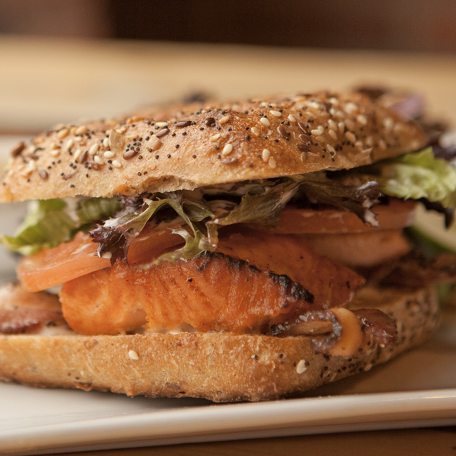 Close-up view of a grilled salmon sandwich