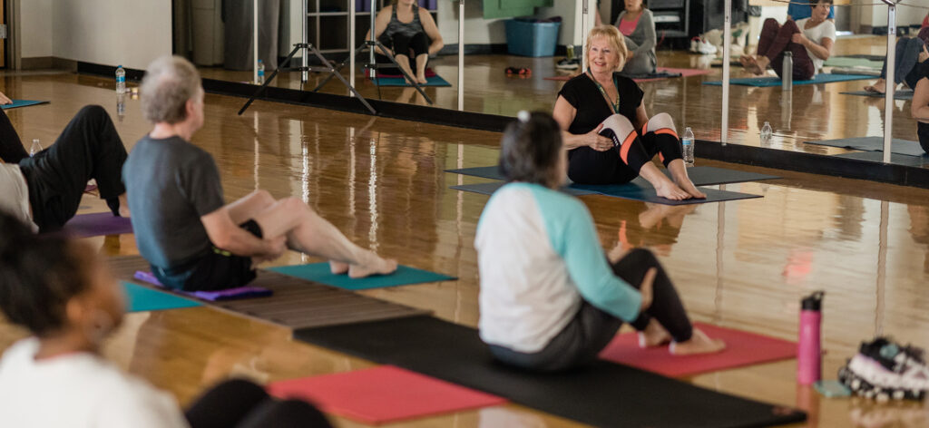 Individuals at a yoga class