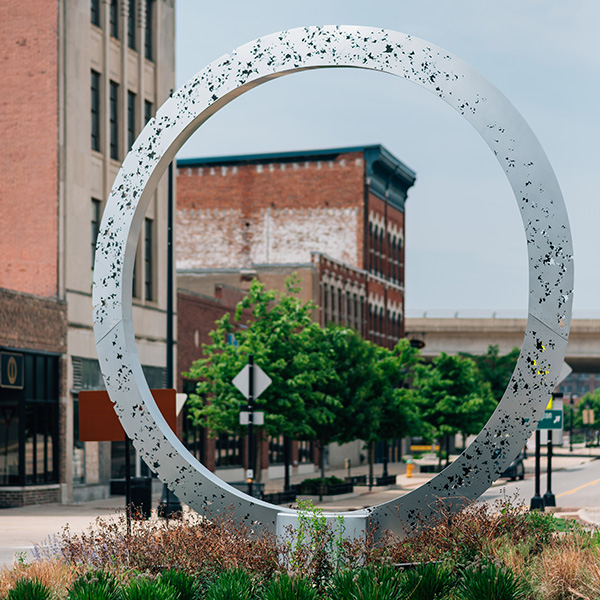 Portal, a sculpture by Bruce White, anchors a roundabout serving as a gateway to the Peoria Warehouse District.