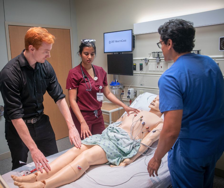 a few students participating in a simulated medical activity