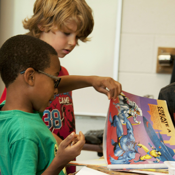 students sharing a book